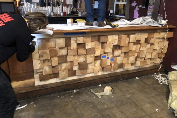 Steve and I screwing the block panels to the bar front